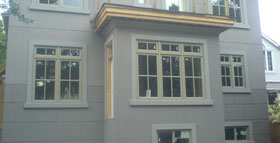 Image of Toronto home stucco using an EIFS-wall system with flat mouldings and block shaped half-inch V joints